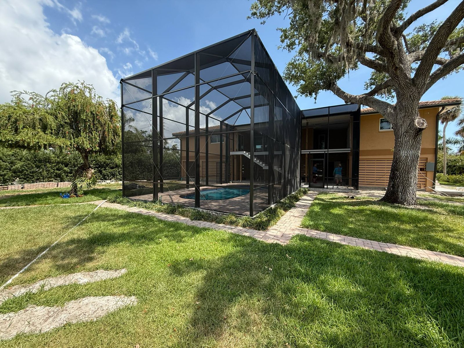 Black aluminum pool screen enclosure from screen room installation in Clermont, FL